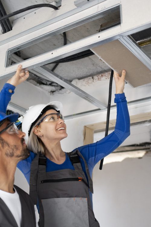 medium-shot-people-wearing-helmets-work